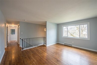 Freshly painted walls and refinished hardwood floo