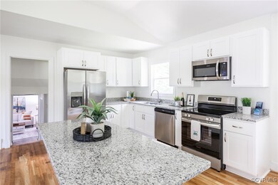 Kitchen with stainless steel appliances, light sto