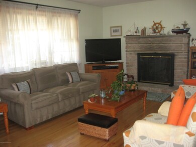 027Living Room boasts Gas Fireplace