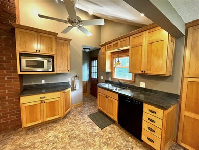 The kitchen has a trendy vaulted ceiling adding to the fun and uniqueness in the space!