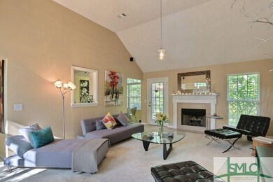 Spacious great room with vaulted ceilings and a wo