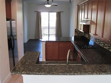 View from the kitchen facing the living room with a view of the pool.