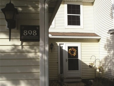 Flower beds surround your entrance. Ready for your