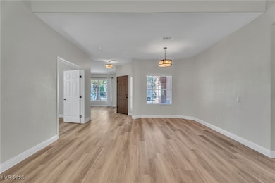 Large dining area can easily accommodate a table and chairs to seat the whole family.