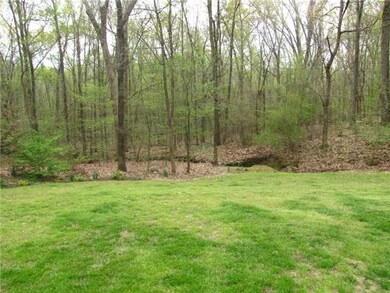 Enjoy the private backyard with wooded backdrop.