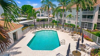 Community pool with fence and a patio area