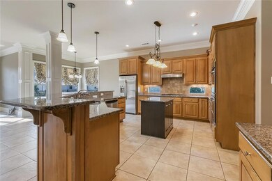 large kitchen with center island, granite counters