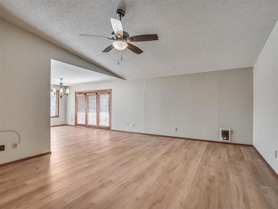 Unfurnished living room with baseboards, a texture