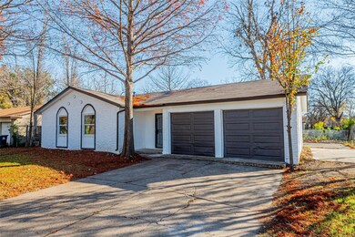 Single story home featuring a garage