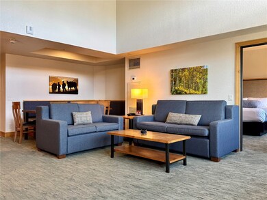 A sofa sleeper and love seat provide sleeping for