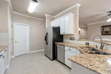Kitchen featuring appliances with stainless steel