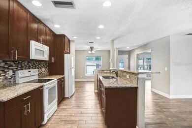 Kitchen with beautiful 42 inch cabinets, granite countertops and beautiful backsplash
