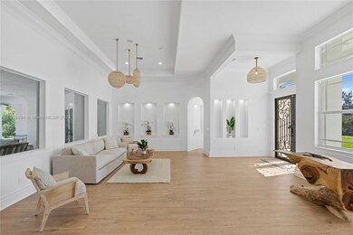 Soaring ceilings and gorgeous wood floors welcome you inside.