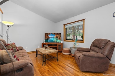 Main level living room has beautiful hardwood floors