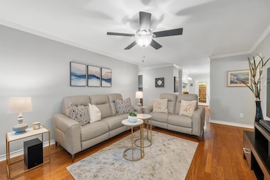 Living area with wood finished floors, a ceiling 