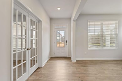 Doorway to outside featuring wood finished floors,