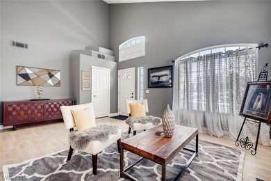 Vaulted ceilings make this large living room feel