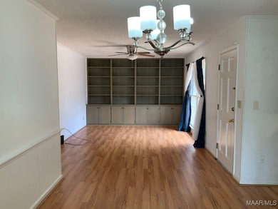 Large open living area open to the kitchen with pl