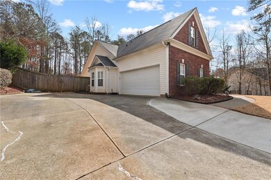 View of side of home with a garage