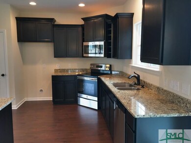Beautiful dark cabinets with granite counters and 