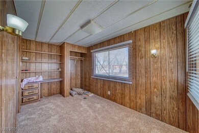 Unfurnished office featuring carpet flooring, wood