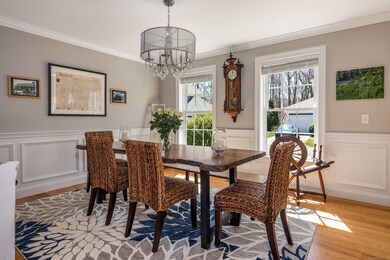 Formal dining room finished with both crown molding and chair rail.