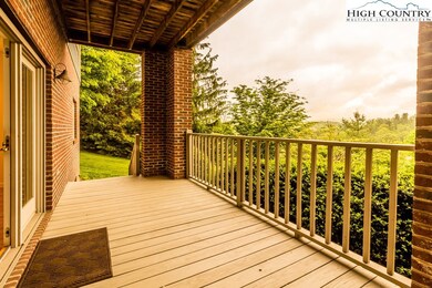 Through the French doors, the living room opens to this upper deck, covered, an excellent spot to enjoy our cool, bug free summers outdoors.
