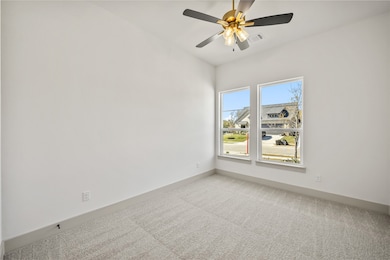 Unfurnished room with carpet floors and ceiling fan
