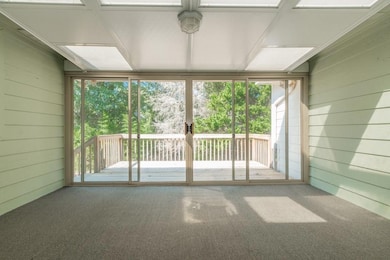 View of Sunroom with Glass & Screen Doors