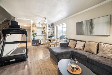 Living area featuring a textured ceiling, ceiling