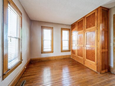 Main level bedroom with built-in closet area