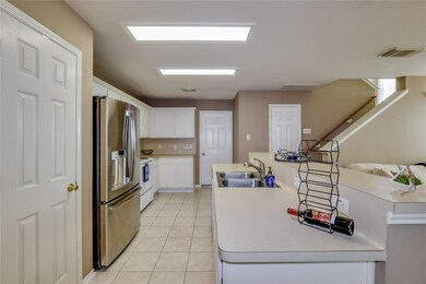 Stairs lead up to front door landing and then up t