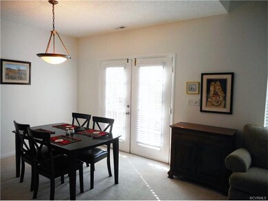 The dining area has French doors that open to...