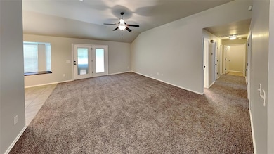 Carpeted empty room with a ceiling fan, lofted cei
