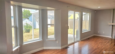 Family room is full of windows to keep this home light and bright
