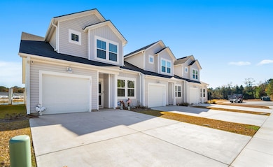 View of front of property featuring a garage