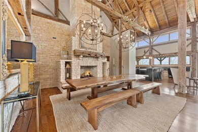 Dining room featuring high vaulted ceiling, wood-