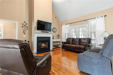 Living area with a fireplace with flush hearth, hi