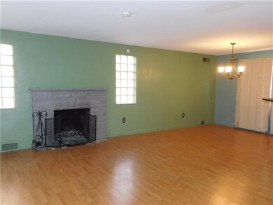 An open concept living/dining room greets you with
