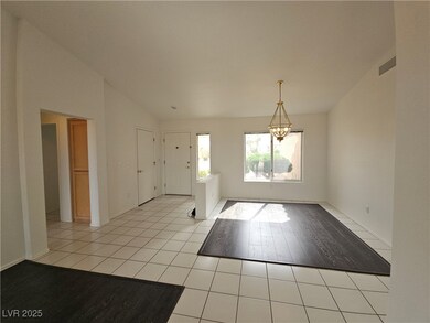 Entrance foyer featuring lofted ceiling, dining ro