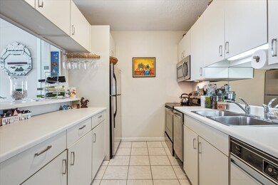 Stylishly coastal white kitchen featuring stainles