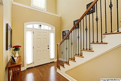 You'll be greeted by luxury upon entering the foyer with rich wood floors, a 2 story foyer and crown moulding.