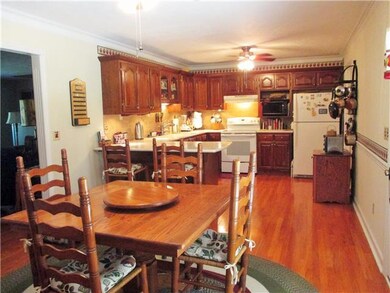 Dining and kitchen area are open and roomy. There's even space for the eat-at bar and extra furnishings. 