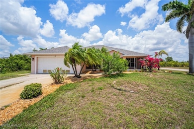 View of front of home featuring driveway, a garage