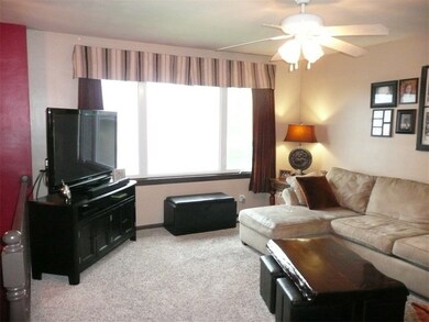 Living room with updated paint and carpet.