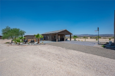 View of front of property with a carport and a mou