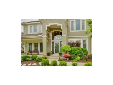 Grand two story entrance sets the stage for this m