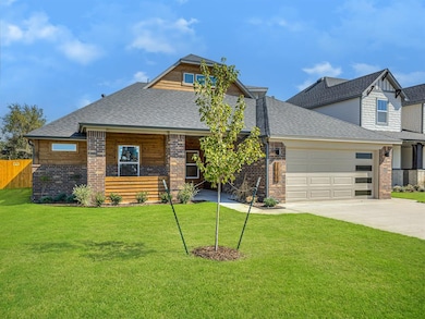 View of front facade with concrete driveway, a shi