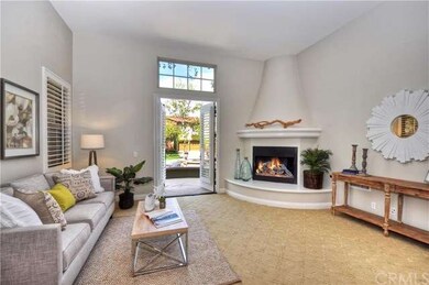 Formal living room with fireplace and French doors
