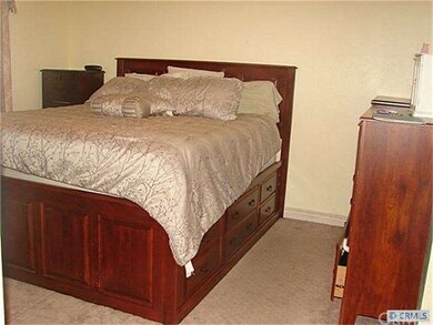 Spacious Master Bedroom with Large Windows